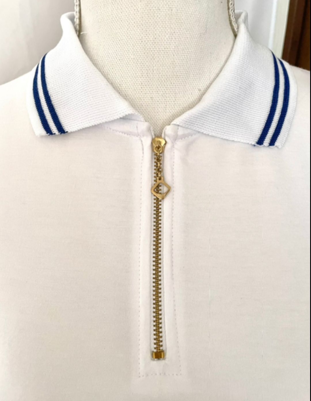 - **"Classic collared design – 100% cotton polo shirt"